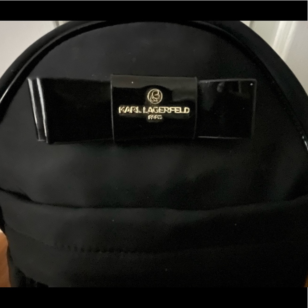 Black Karl Lagerfeld backpack used a hand full of times. Great condition